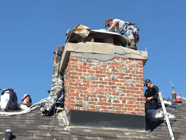 Bloomfield Chimney Sweep installing a custom chimney crown in Bloomfield, CT
