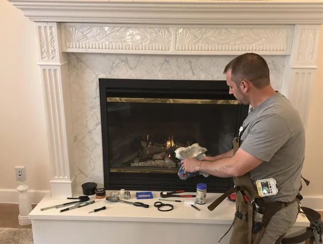 Bloomfield Chimney Sweep performing fireplace maintenance in Bloomfield, CT